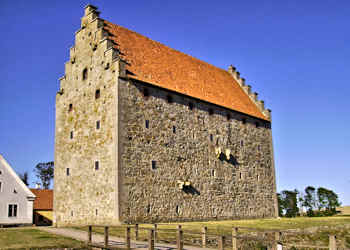 Glimmingehus from the side on a sunny day with blue sky